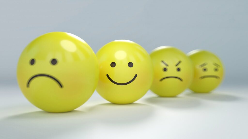 Emoticons representing different emotions through mental health and wellbeing.